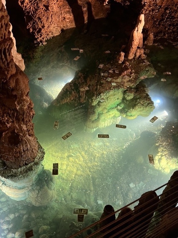 Underground cavern with illuminated pool